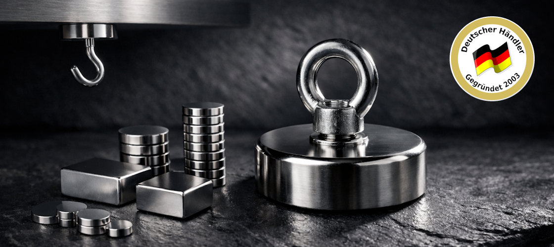 Neodym Magnete Sortiment – Scheibenmagnete, Blockmagnete, Hakenmagnete und Bergemagnet mit Öse auf dunklem Schiefer